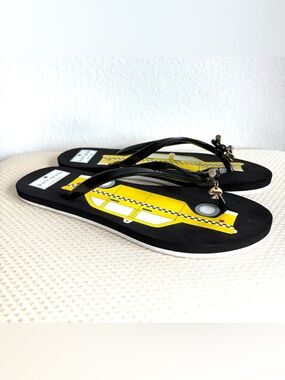Kate Spade New York Taxi Cab flip flops.